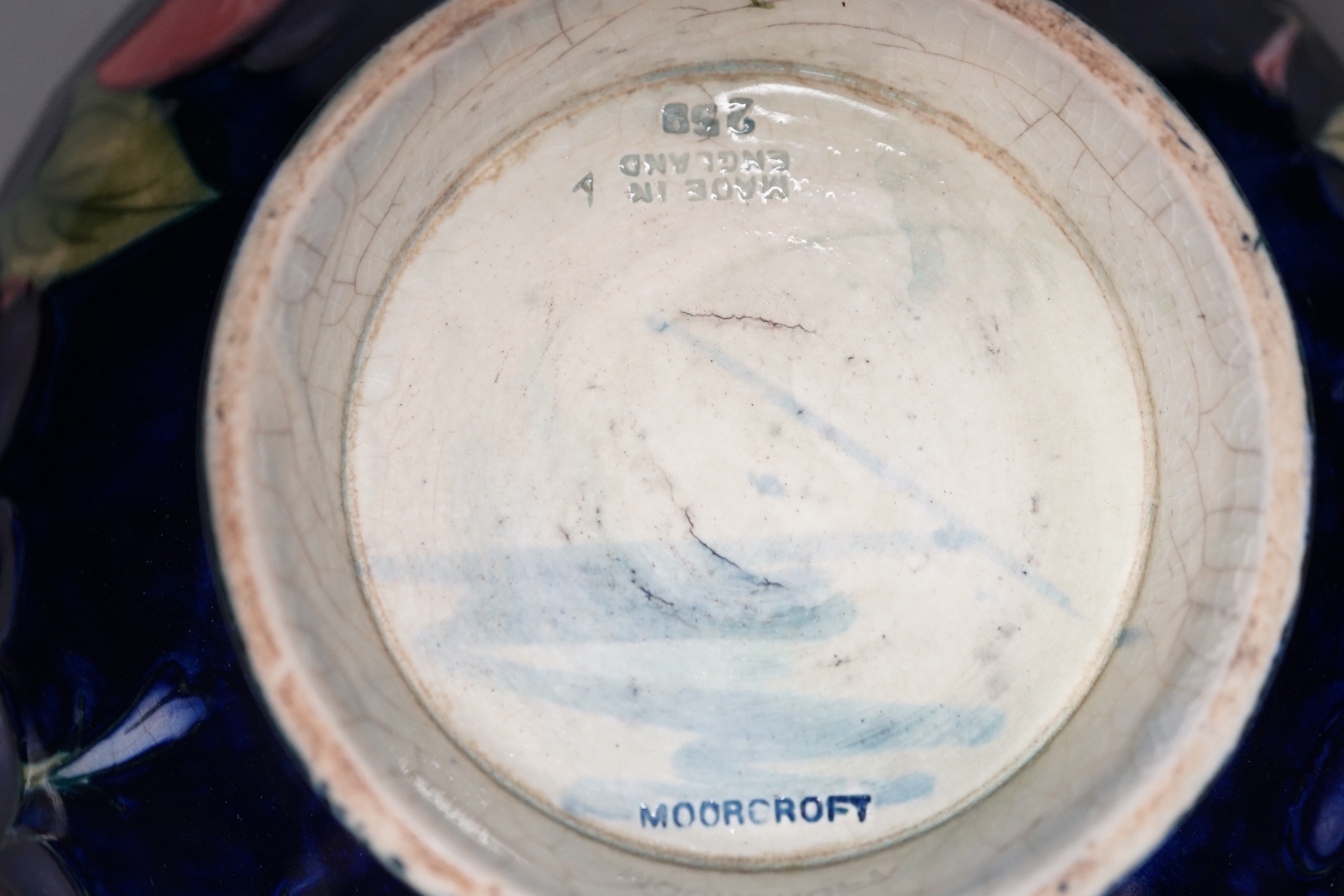 A Moorcroft Wisteria pattern bowl - 18cm wide